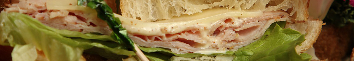 Eating Sandwich at Tostado Sandwich Bar restaurant in Jamaica Plain, MA.